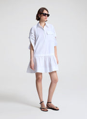woman wearing white mini shirtdress