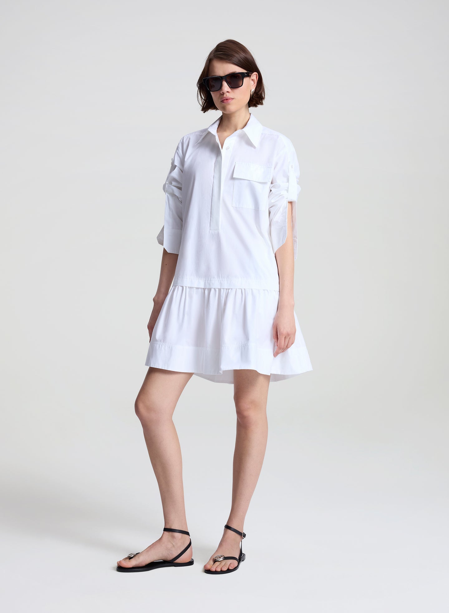 woman wearing white mini shirtdress