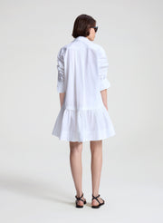 woman wearing white mini shirtdress