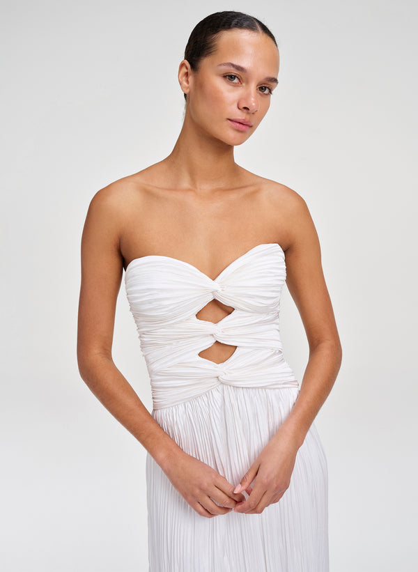 woman wearing white pleated gown