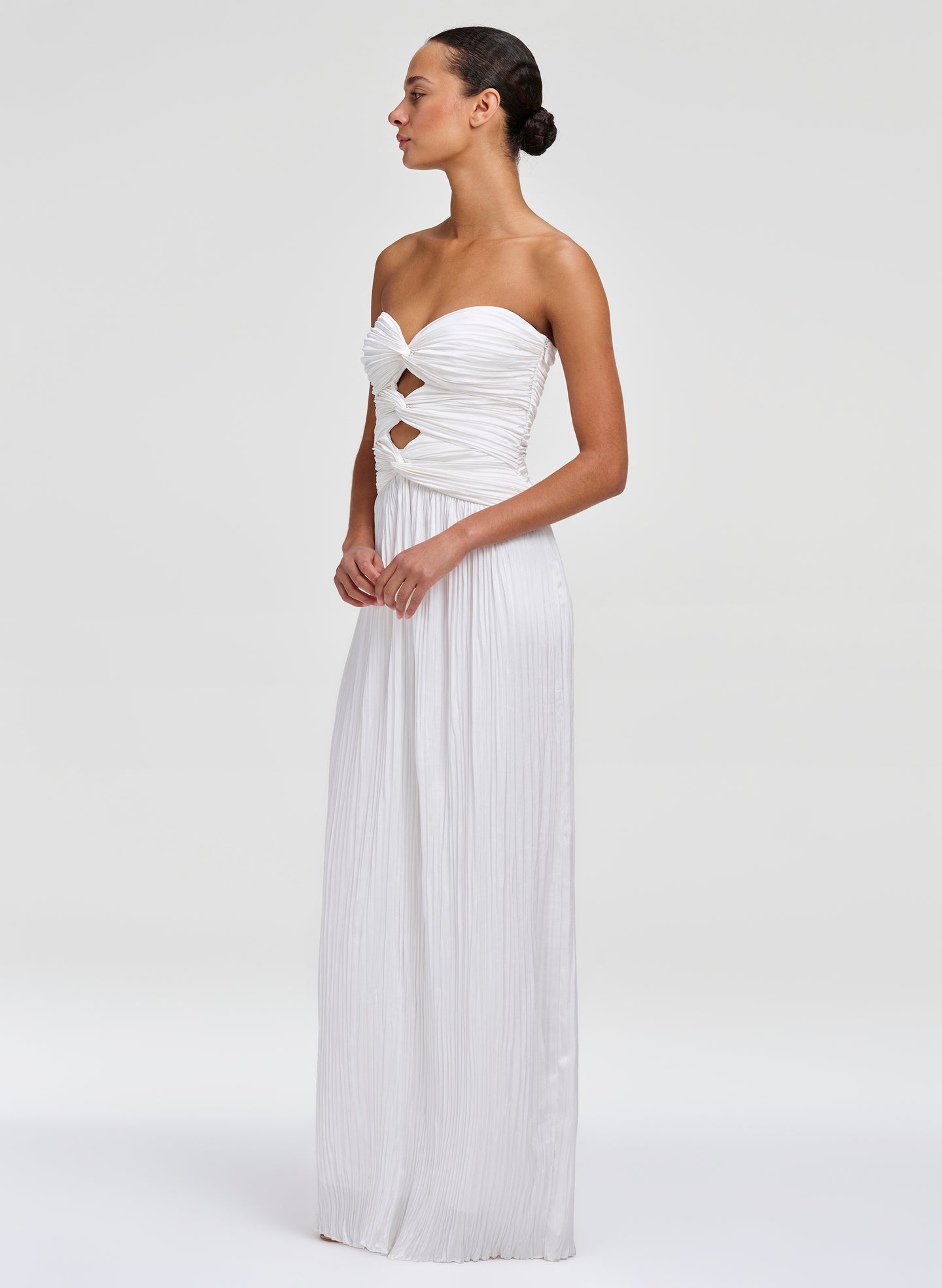 woman in white gown with pleating