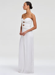 woman in white gown with pleating