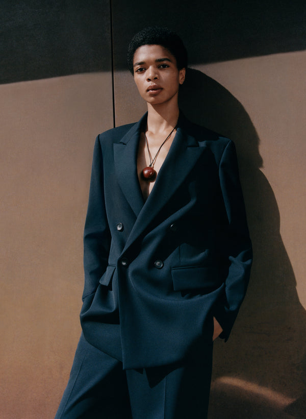 woman wearing navy blue suit