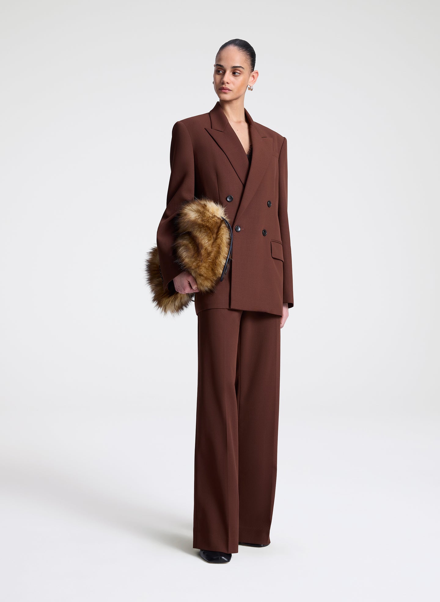 woman wearing brown blazer and matching pants