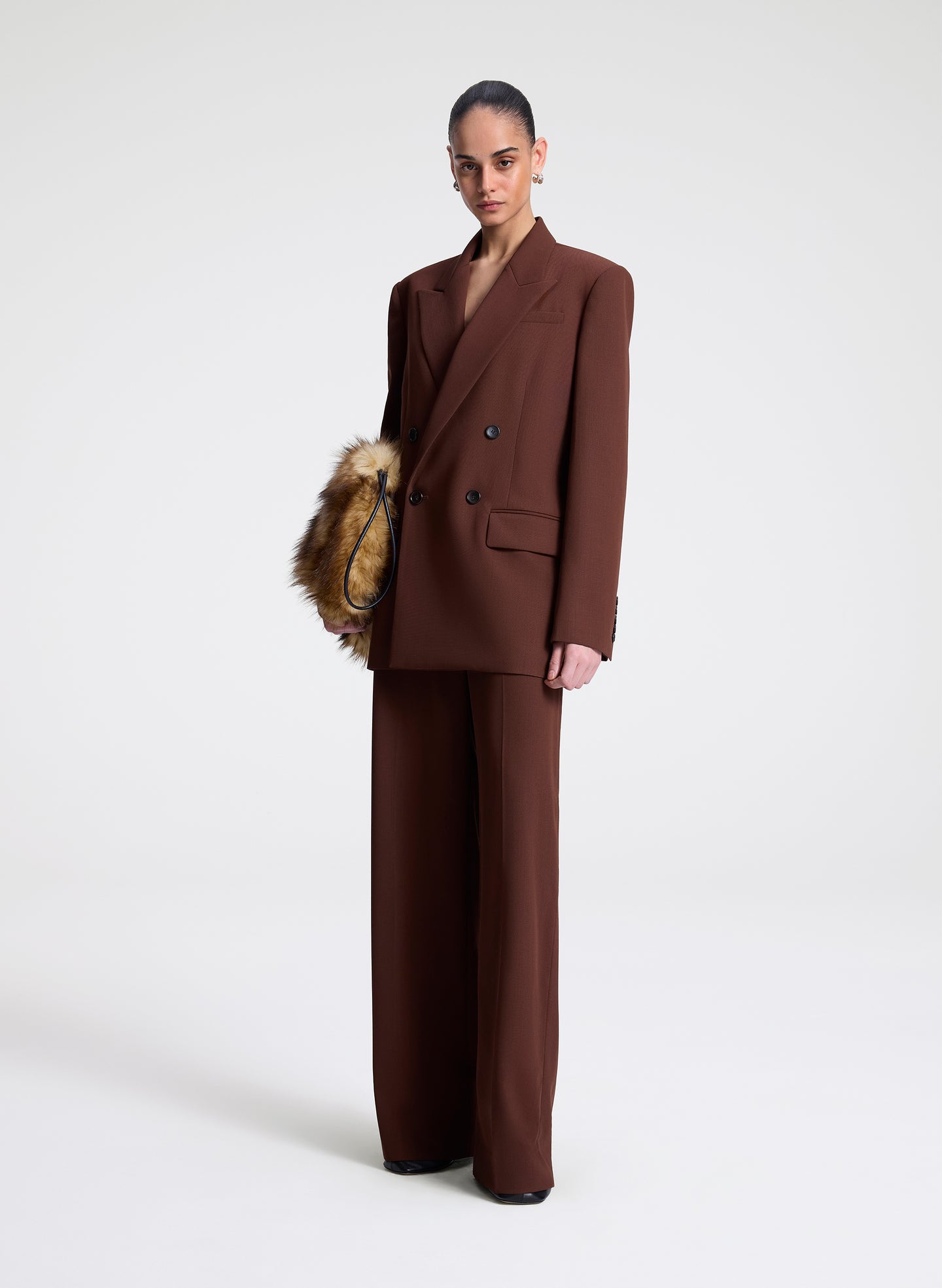 woman wearing brown blazer and matching pants