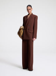woman wearing brown blazer and matching pants