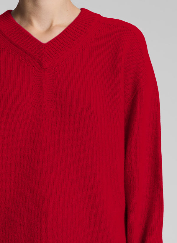 woman wearing red v neck sweater and red pants