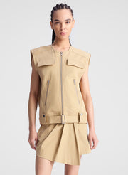 woman wearing beige sleeveless jacket and matching skort