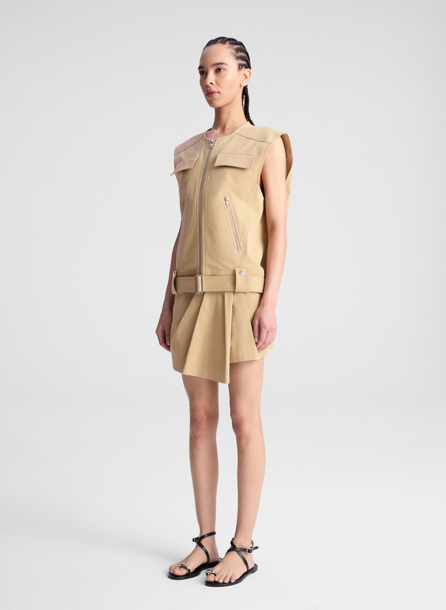 woman wearing beige sleeveless jacket and matching skort