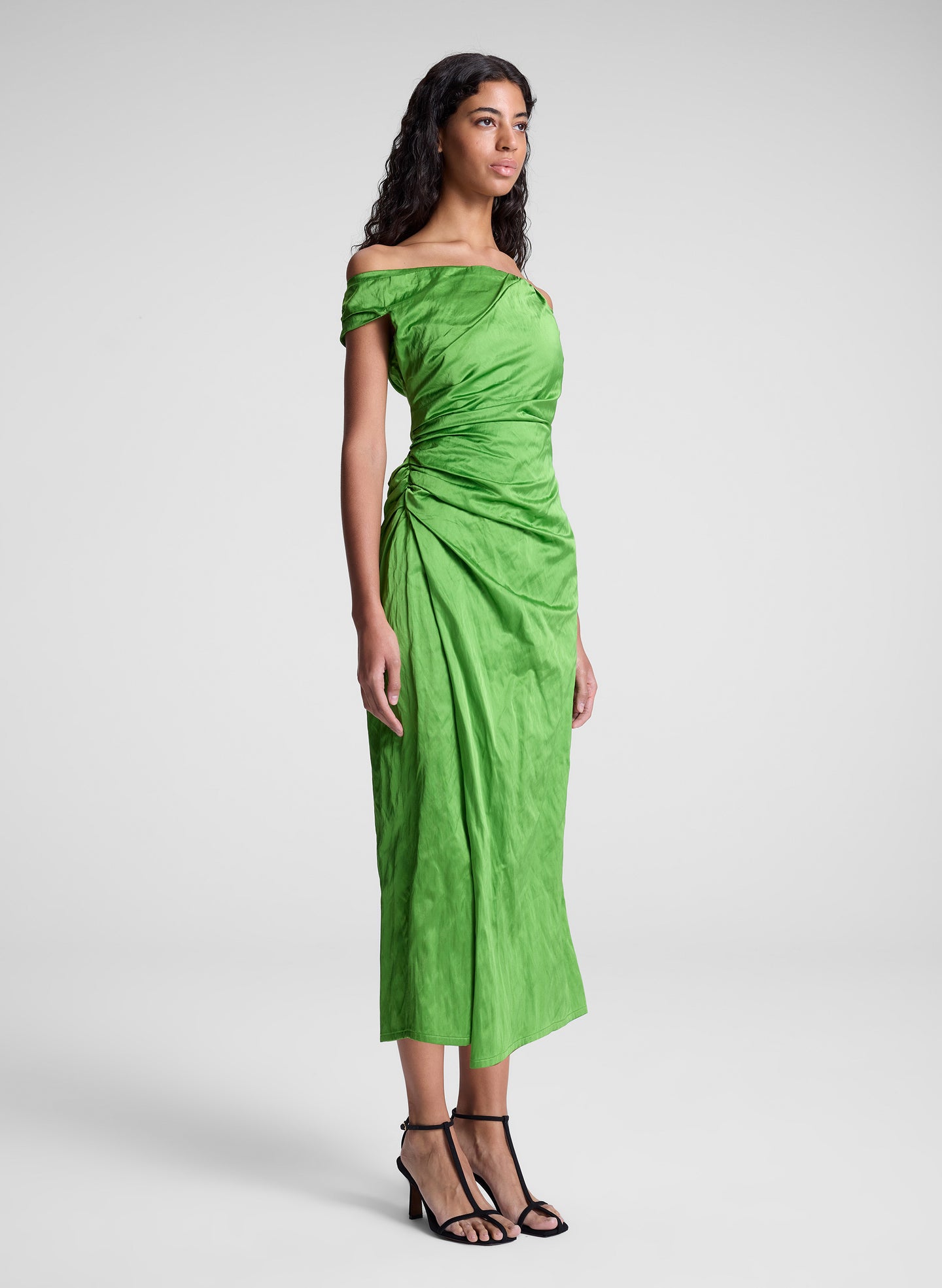 woman wearing green off shoulder midi dress
