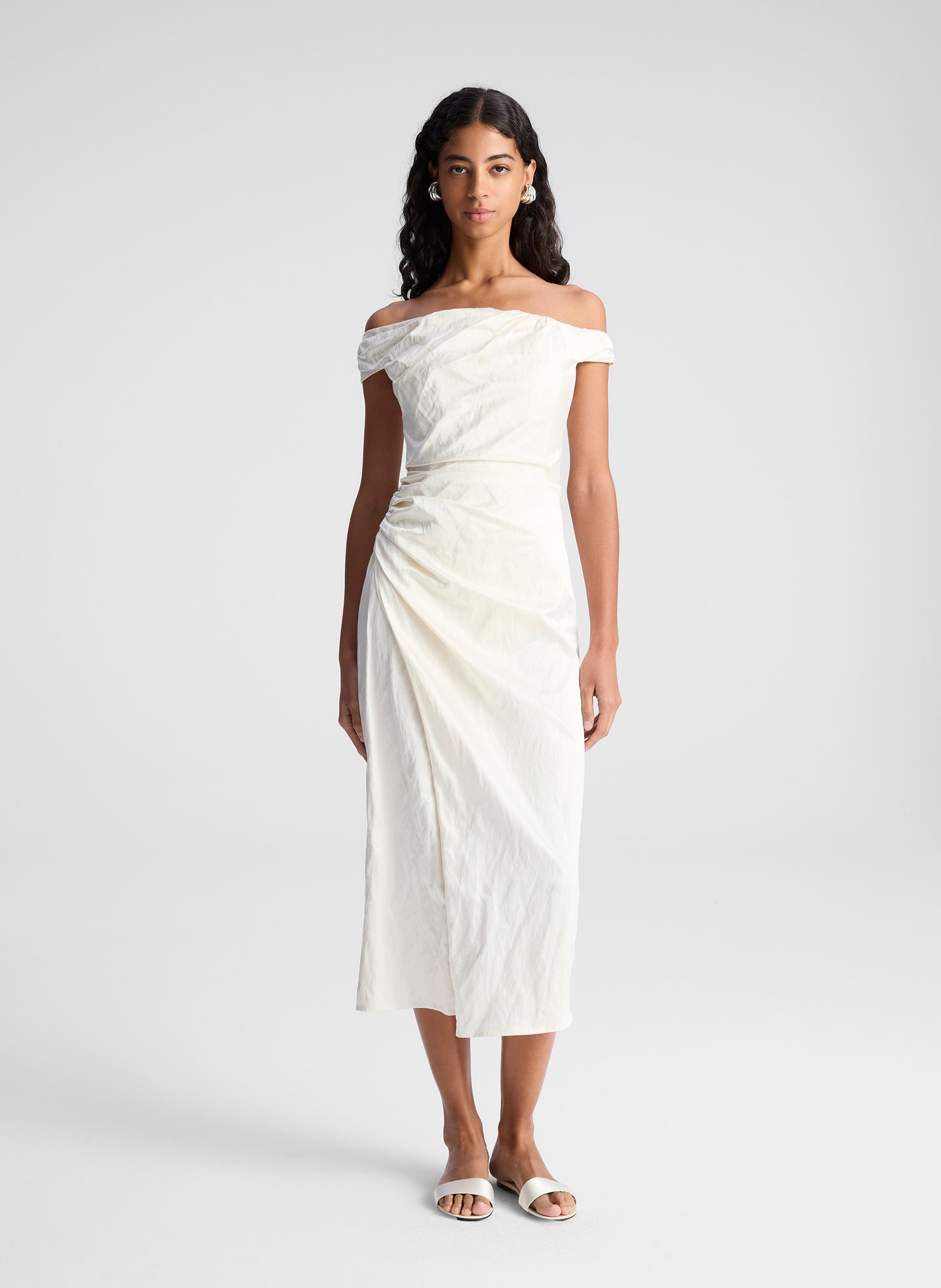 woman wearing whit off shoulder midi dress