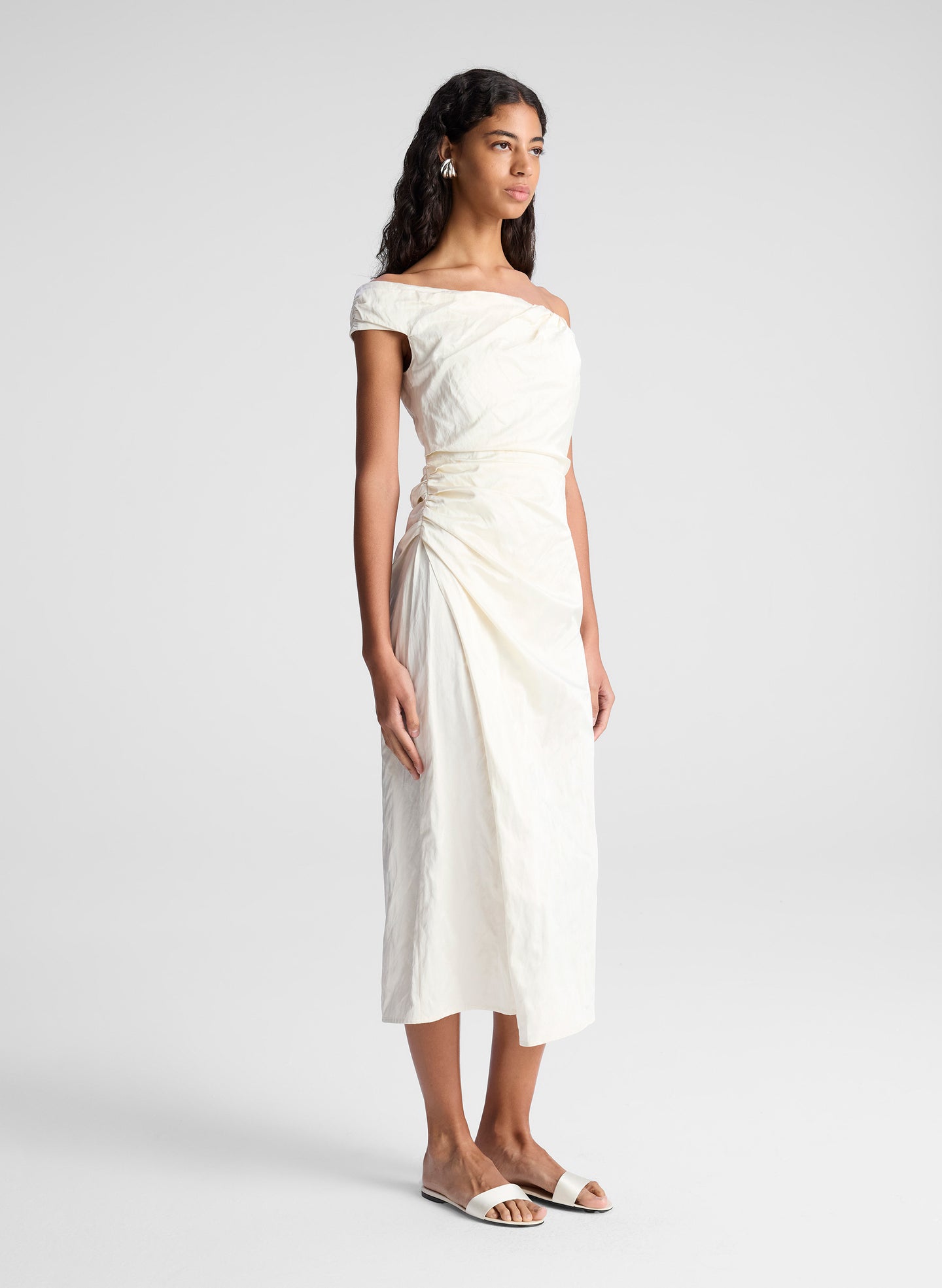 woman wearing whit off shoulder midi dress