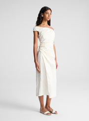 woman wearing whit off shoulder midi dress