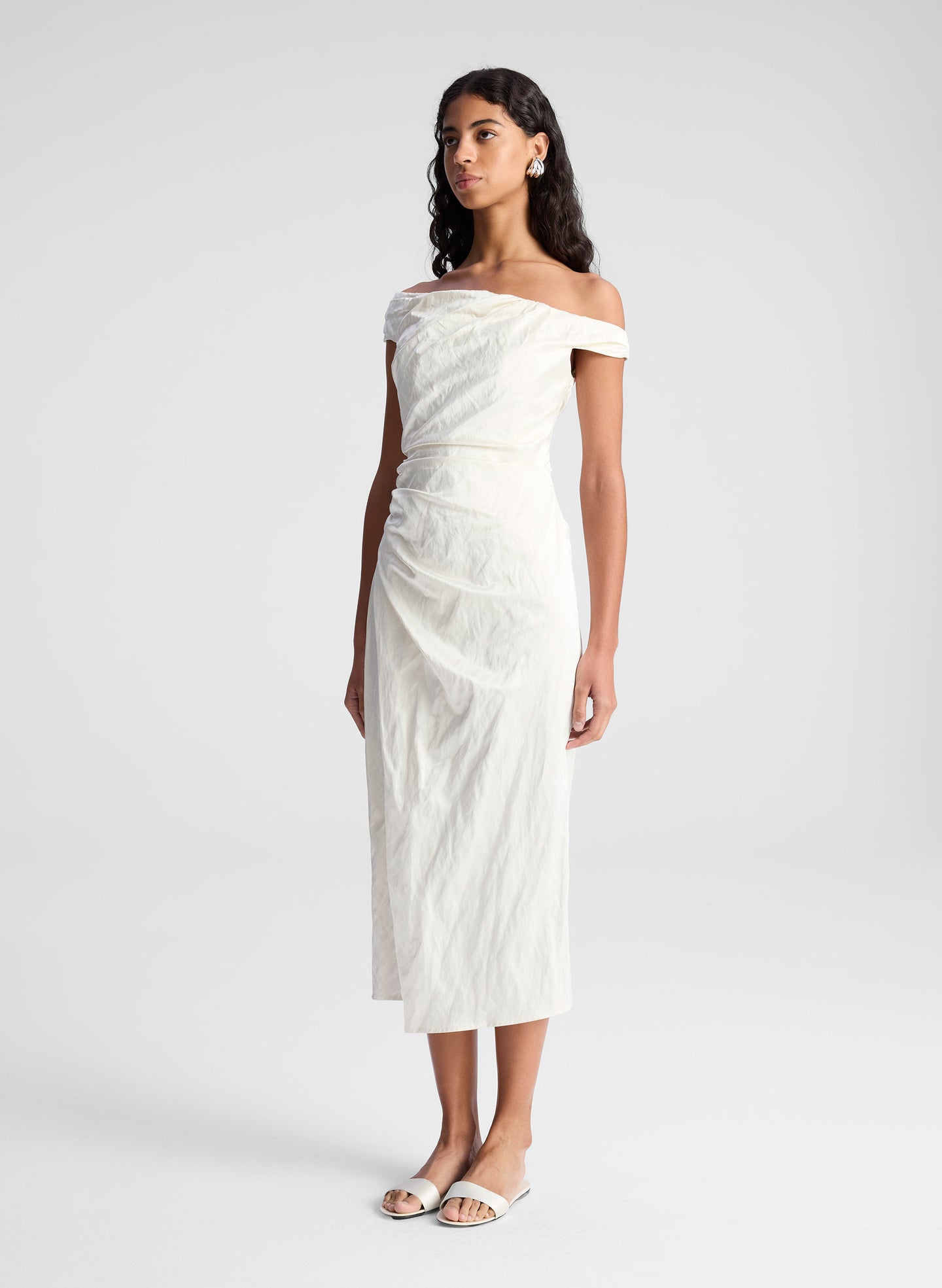 woman wearing whit off shoulder midi dress