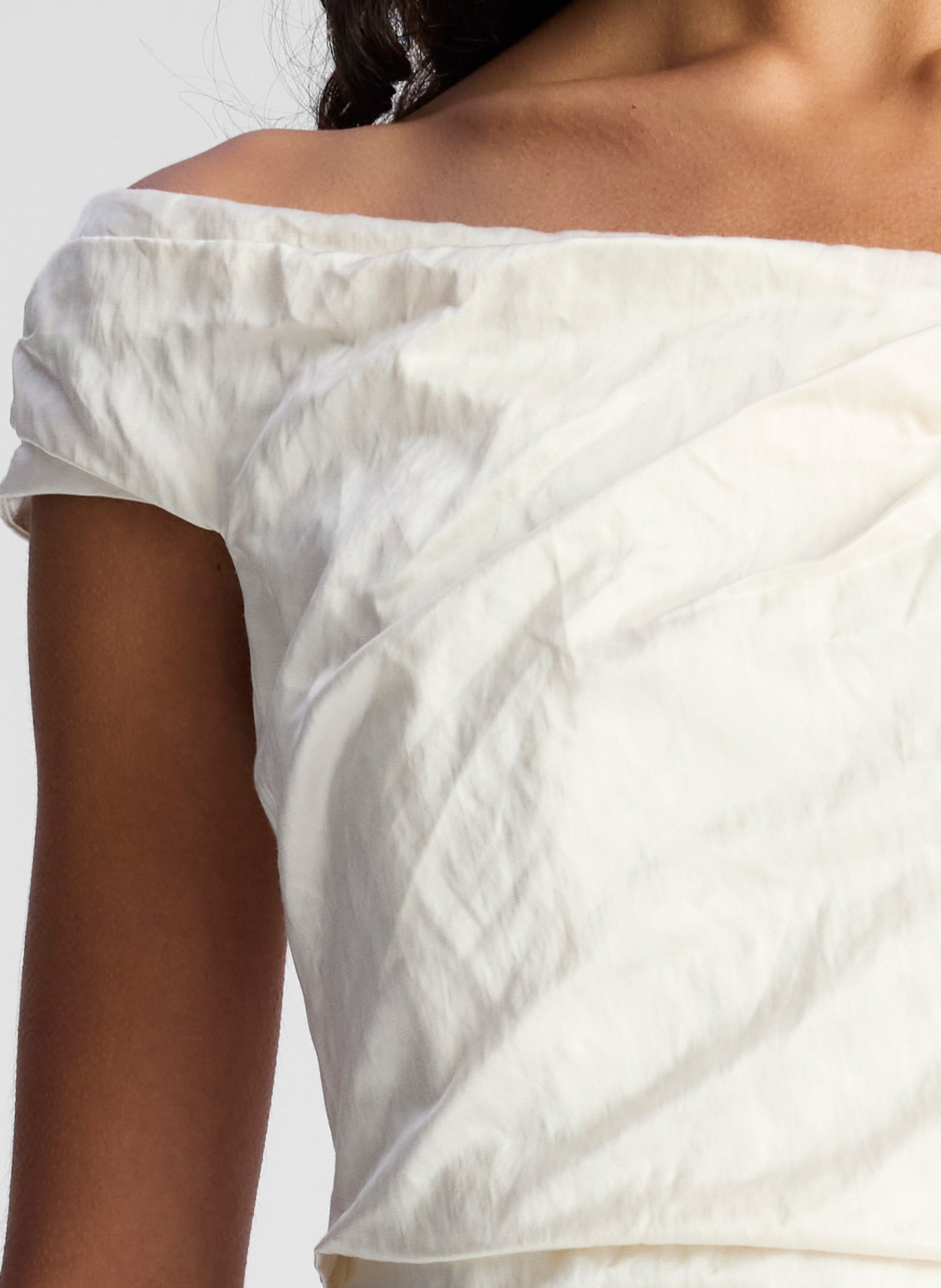 woman wearing whit off shoulder midi dress