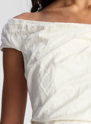 woman wearing whit off shoulder midi dress