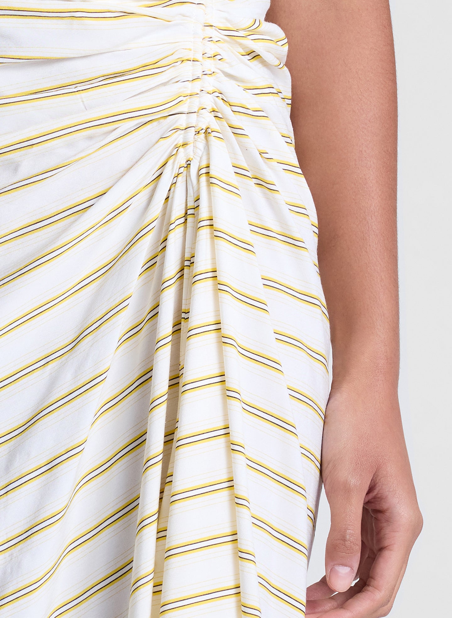 woman wearing yellow striped one shoulder dress