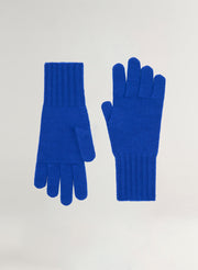 Pair of blue gloves on a light gray background