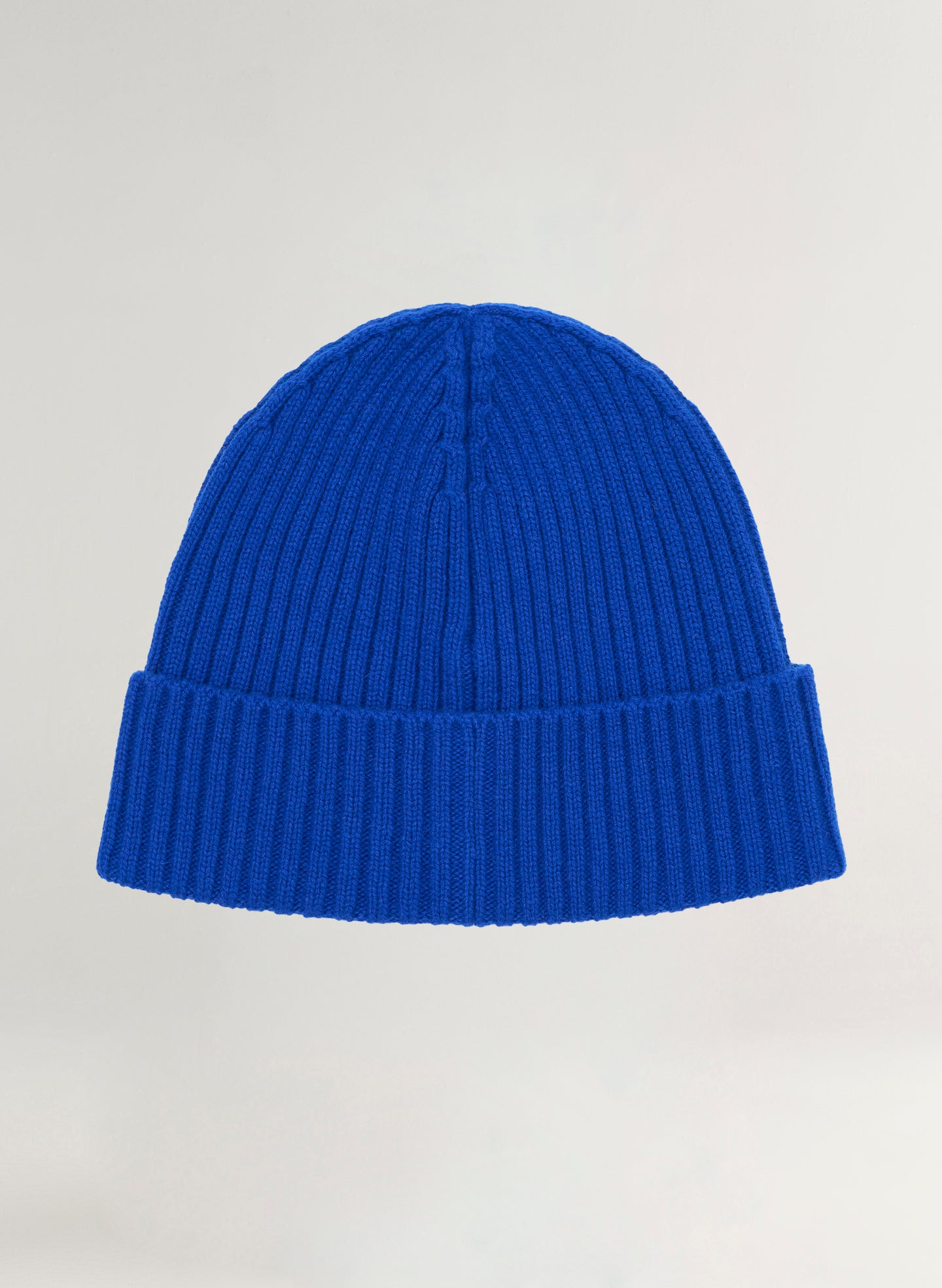 Blue beanie on a light gray background