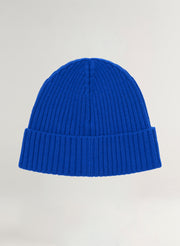 Blue beanie on a light gray background