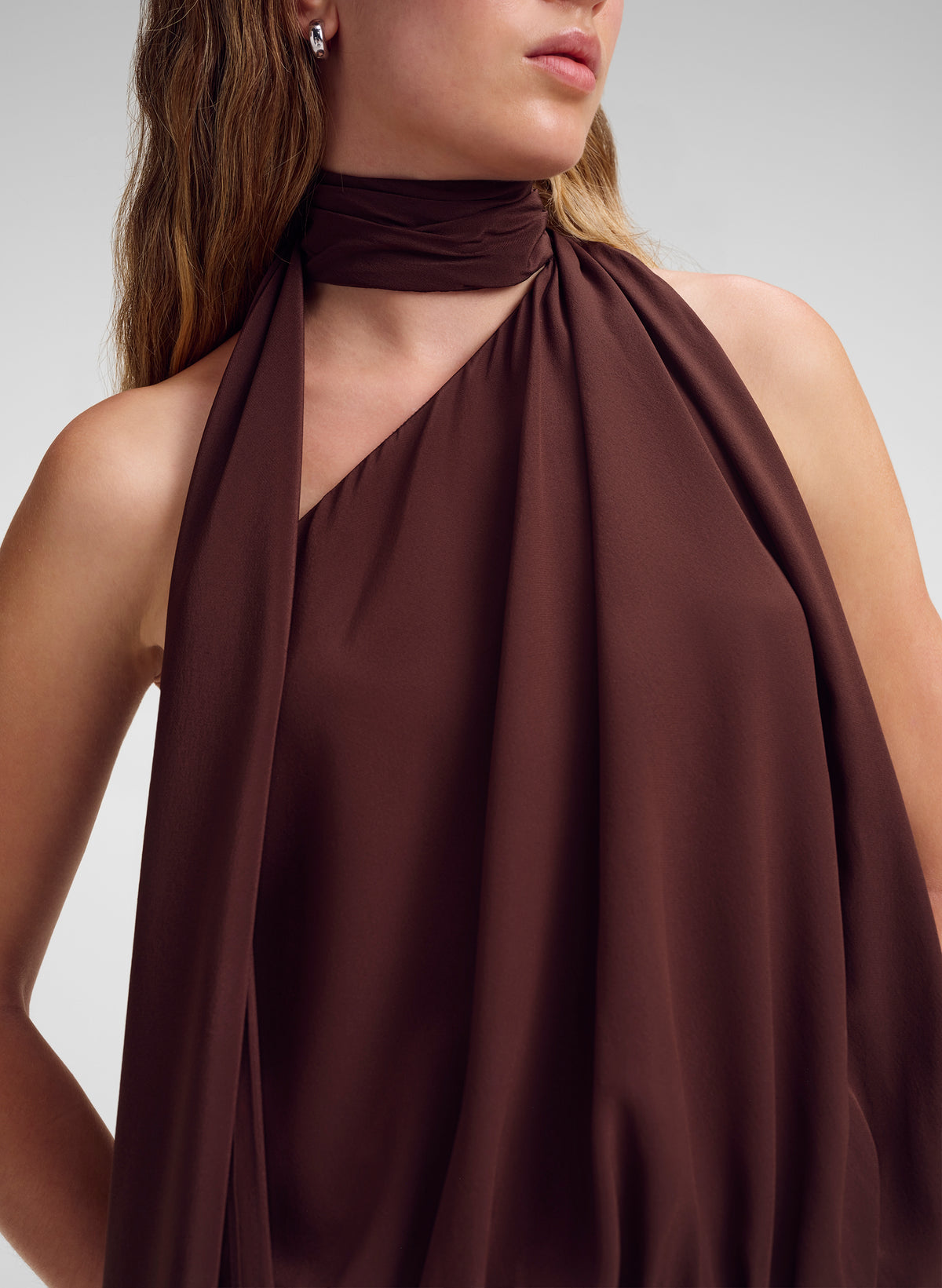 woman wearing brown draped silk top