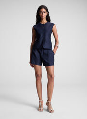 woman wearing navy blue vest and matching shorts