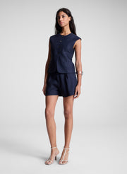 woman wearing navy blue vest and matching shorts