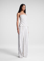 woman wearing striped halter top and matching striped pant set