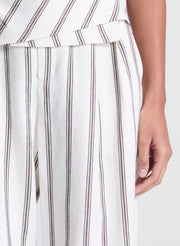 woman wearing striped halter top and matching striped pant set