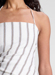 woman wearing striped halter top and matching striped pant set