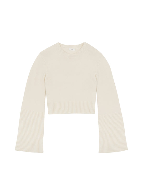 flatlay view of woman wearing cream sweater and beige pants