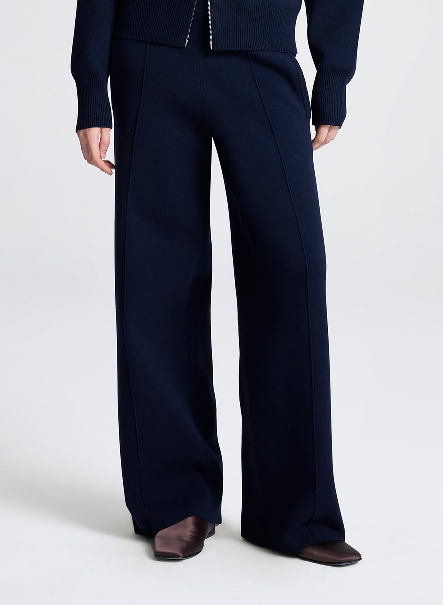 Navy blue suit with wide-leg pants on a white background