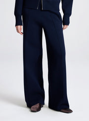Navy blue suit with wide-leg pants on a white background