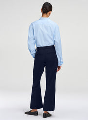 woman wearing blue shirt and navy pants