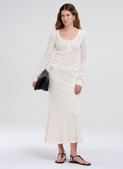 woman wearing cream knit set