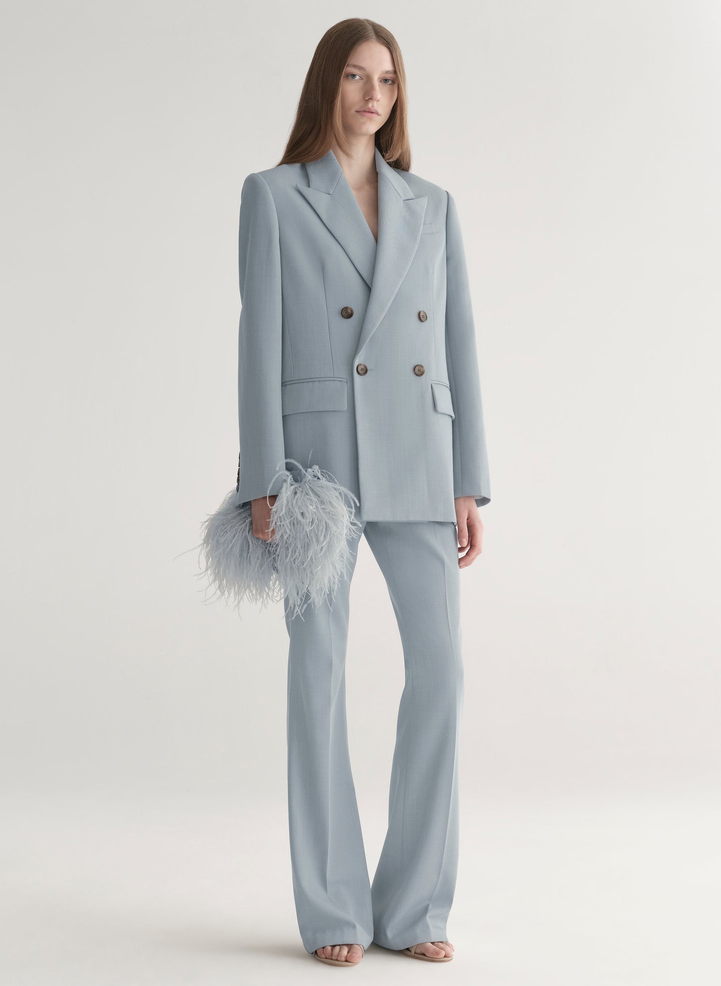 woman wearing light blue oversized suit