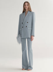 woman wearing light blue oversized suit