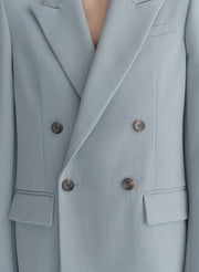 woman wearing light blue oversized suit