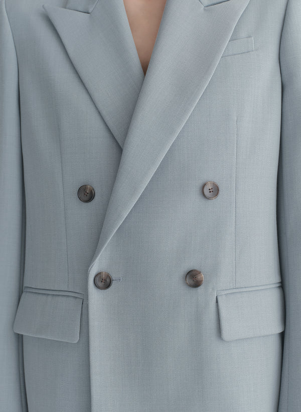 woman wearing light blue oversized suit