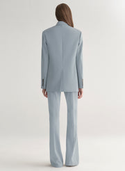 woman wearing light blue oversized suit