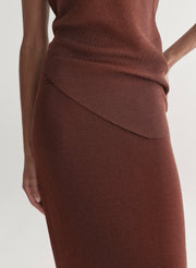 woman wearing rust knit top and skirt set
