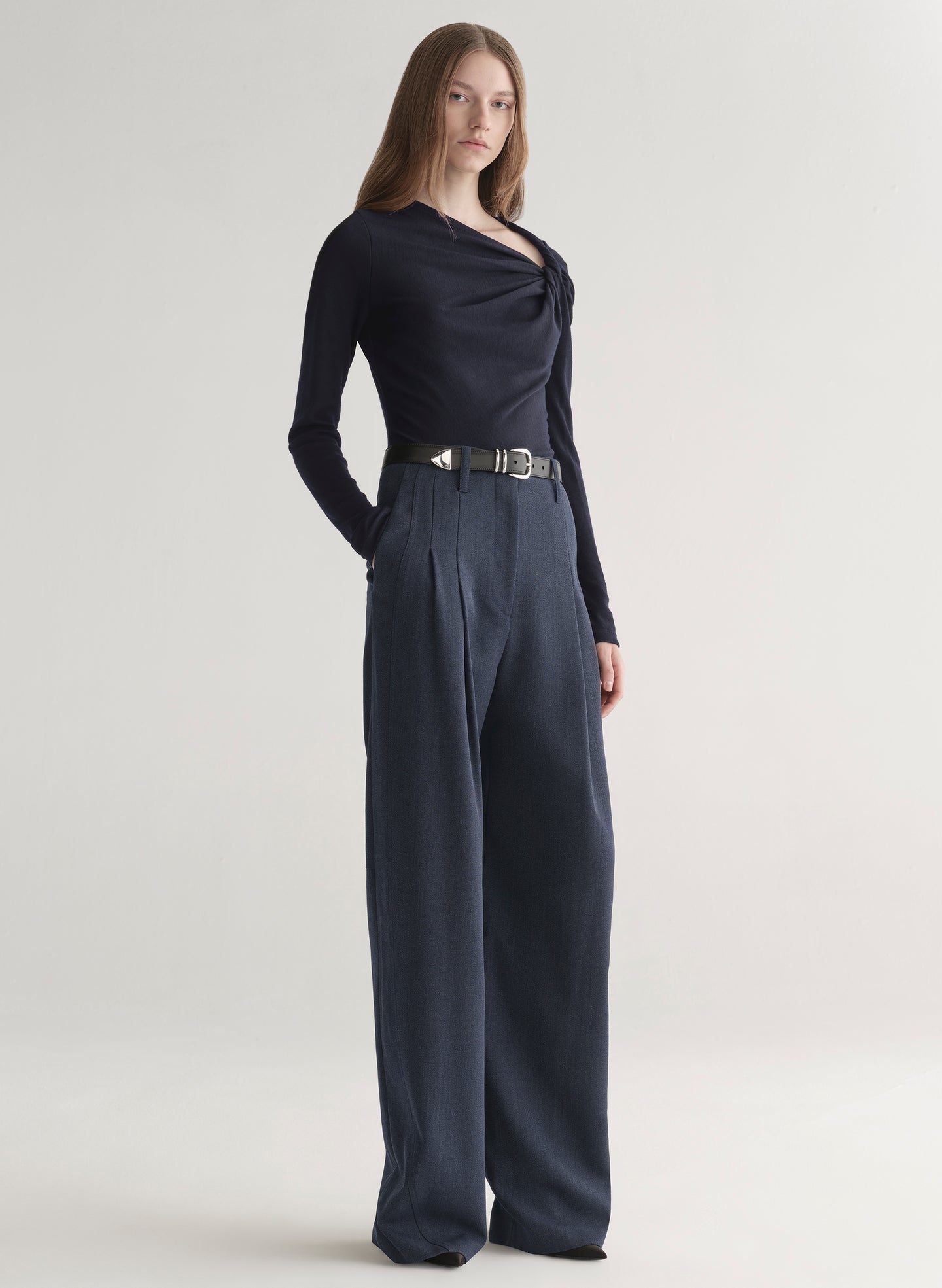 woman wearing navy blue top and and dark blue pants