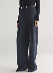 woman wearing navy blue top and and dark blue pants