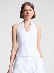 woman wearing white halter top and white linen shorts