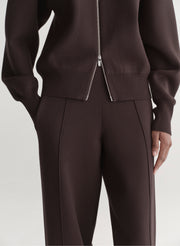 woman wearing brown zip cardigan and matching knit pant