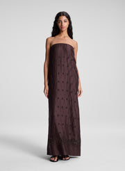 woman wearing dark brown strapless embroidered maxi dress