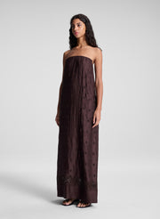 woman wearing dark brown strapless embroidered maxi dress