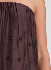 woman wearing dark brown strapless embroidered maxi dress