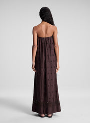 woman wearing dark brown strapless embroidered maxi dress