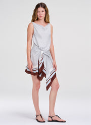 woman in draped mini dress